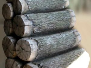 A stack of wood logs acts laying horizontally to create steps/climber to access playground deck